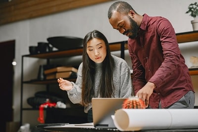 Leader helping employee